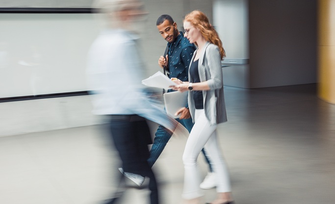 Business people walking fast