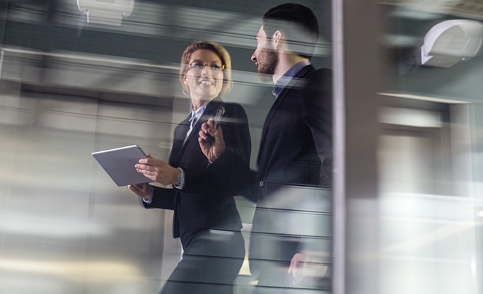 Two business people walking